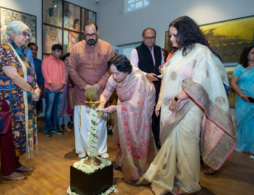 Mrs. Uma Jain lighting the lamp at the opening ceremony of Ravi Jain Memorial, in the presence of Dr. Rashmi Das, Chairperson AuTypical (right), Mr. Rajeev Chandrashekar, Honarable Minister of State for Electronics and Information Technology, Skill Development and Entrepreneurship (middle) and Senior Artist Kanchan Chander (extreme left) along with Uday Jain, Director, Dhoomimal